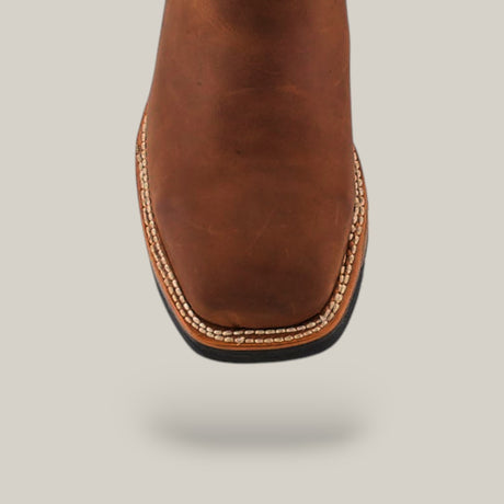 A close-up of the Crazy Brown Military Composite Toe - E6017 boot showcases its durable brown leather, square toe, and white stitching, reminiscent of classic Texas Country Work Boots, set against a plain light gray background.