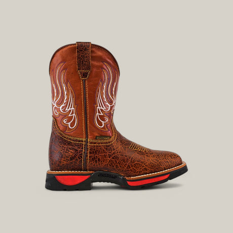 The Jurasic Honey Composite Toe - E6080 features a single brown boot with intricate white wing-like stitching on the shaft, textured leather design, and a durable black sole with red accents, all set against a plain light background.