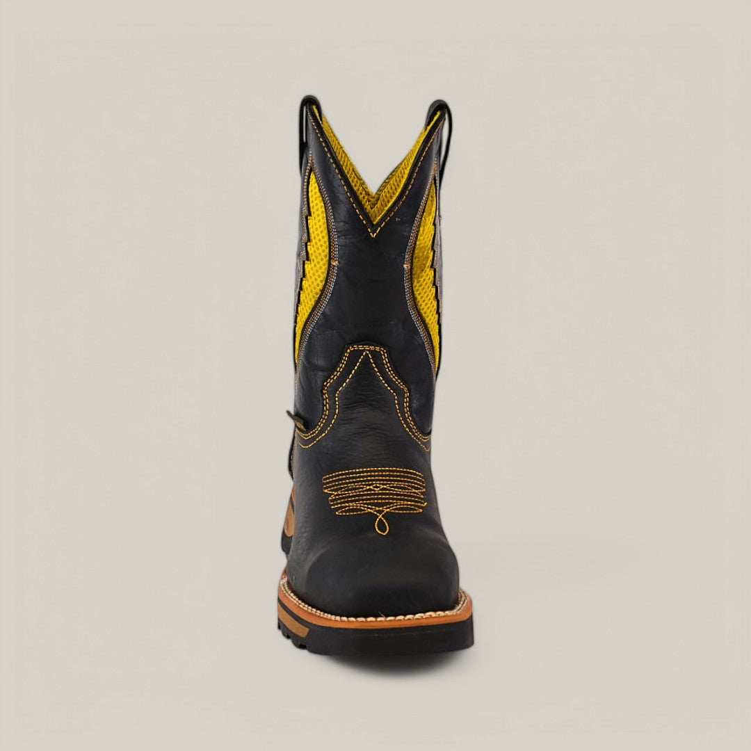 Front view of the Rhino Black Composite Toe - E6087 featuring intricate yellow stitching on a black cowboy boot with a rugged sole, highlighting durability and comfort. The tall shaft has pull tabs and a decorative curved pattern, set against a plain light gray background.