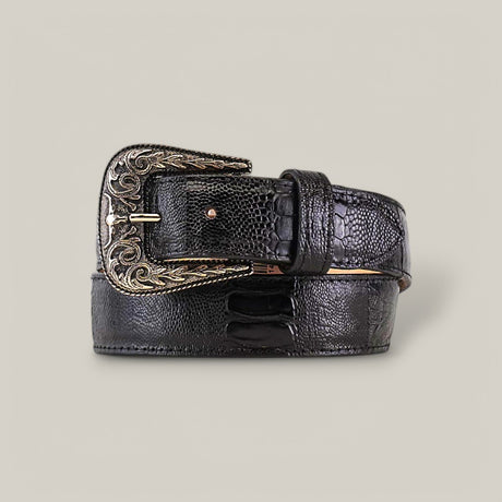 The Exotic Full Quilt Ostrich Leg - Texas Buckle - Black Belt is a textured black leather belt featuring a gold-toned buckle with intricate scrollwork, coiled to showcase its elegant design and craftsmanship.