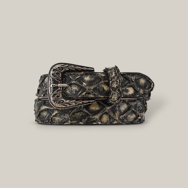 The Exotic Full Quilt Pirarucu Fish - Texas Buckle - Rustic Bone Belt showcases an intricately patterned dark leather strap with an ornate, engraved metal buckle, coiled neatly against a neutral backdrop and exuding luxurious craftsmanship.