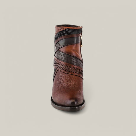 The scene features a front view of the Honey Laser & Woven - Round Toe - CU619, a brown ankle boot with black decorative straps and textured patterns. Its stylish leather finish stands out against a light background.