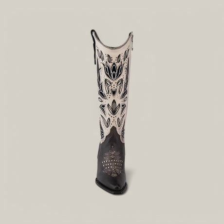 A single cowboy boot, Product CU781, boasts intricate decorative patterns on a plain backdrop. The snip toe features silver designs with subtle studs, and the upper part highlights elegant Tokio Gray embroidery accentuated by bold black details.