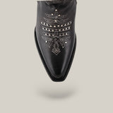 The CU781 boot is crafted from black leather with a snip toe, showcasing intricate Tokio Gray embroidery and silver studs in a decorative pattern against a plain background.