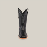 The Exotic Python - Black - Square Toe boot is shown from the front, featuring a detailed textured pattern on a beige background. Made from exotic python leather, it includes a wooden sole and two pull tabs on the sides at the top.