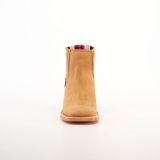 The Prime Suede Honey Square Toe is showcased against a white background. Featuring a tan suede hue, this ankle boot has a flat sole and square toe. A red plaid and beige pull tab adds contrast, embodying the Cowboy Fashion trend.