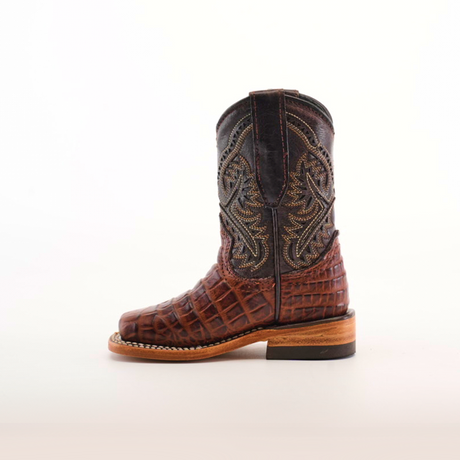 A single handcrafted Caiman Belly Print Chocolate Square Toe cowboy boot, featuring intricate stitching and a premium leather surface, is displayed on a white background. It boasts a wooden sole and rounded toe, exuding timeless elegance.