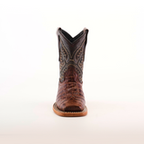 A handcrafted cowboy boot, the Caiman Belly Print Chocolate Square Toe, is centered on a white background, showcasing its premium dark stitched shaft and textured brown leather toe. The light brown sole stands out with its detailed stitching.