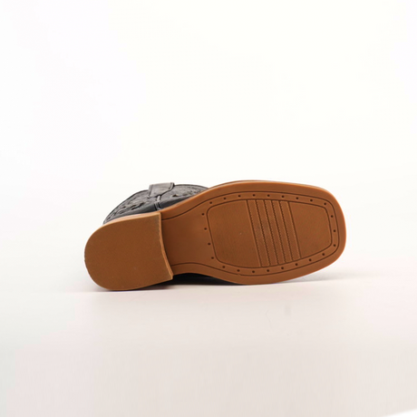 Bottom view of a single Python Print Black Square Toe shoe on white background. The light brown cowhide leather sole has textured rectangular and linear grooves for grip, with a slightly raised heel.