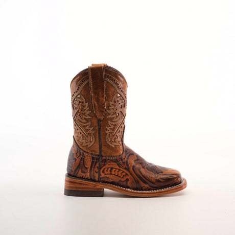 The Handtooled Leave Orix Square Toe boot, crafted from brown cowhide leather with intricate stitching and decorative patterns on the shaft and foot, displays traditional craftsmanship against a plain white background.