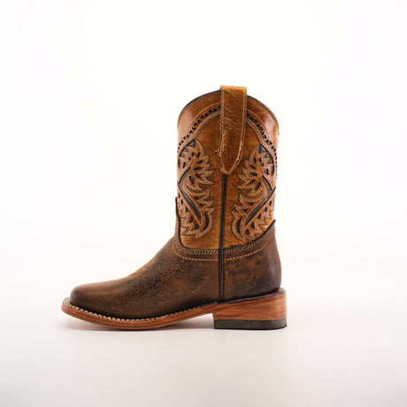 A side view of the Azkar Tan Square Toe cowboy boot showcases its rich cowhide leather and intricate stitched patterns on the shaft. It has a slightly worn look, rounded toe, and low stacked heel, all set against a plain white background.