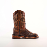 A Loggerhead Turtle Print brown Rodeo Toe cowboy boot, made of premium cowhide leather with detailed stitching, stands upright on a plain white background. It features a decorative pattern on the shaft and a low wooden heel.