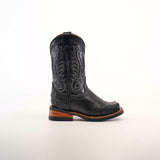 The Karoo Ostrich Half Cowhide Print Black Rodeo Toe boot, featuring intricate stitching on ostrich leather, is set against a white background. It has a wooden heel and textured details on the foot and shaft, offering a classic western style.