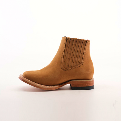 The Prime Suede Honey Square Toe boot is a single brown suede ankle boot with a square toe, elastic side panel, and wooden heel, showcased against a plain white background.