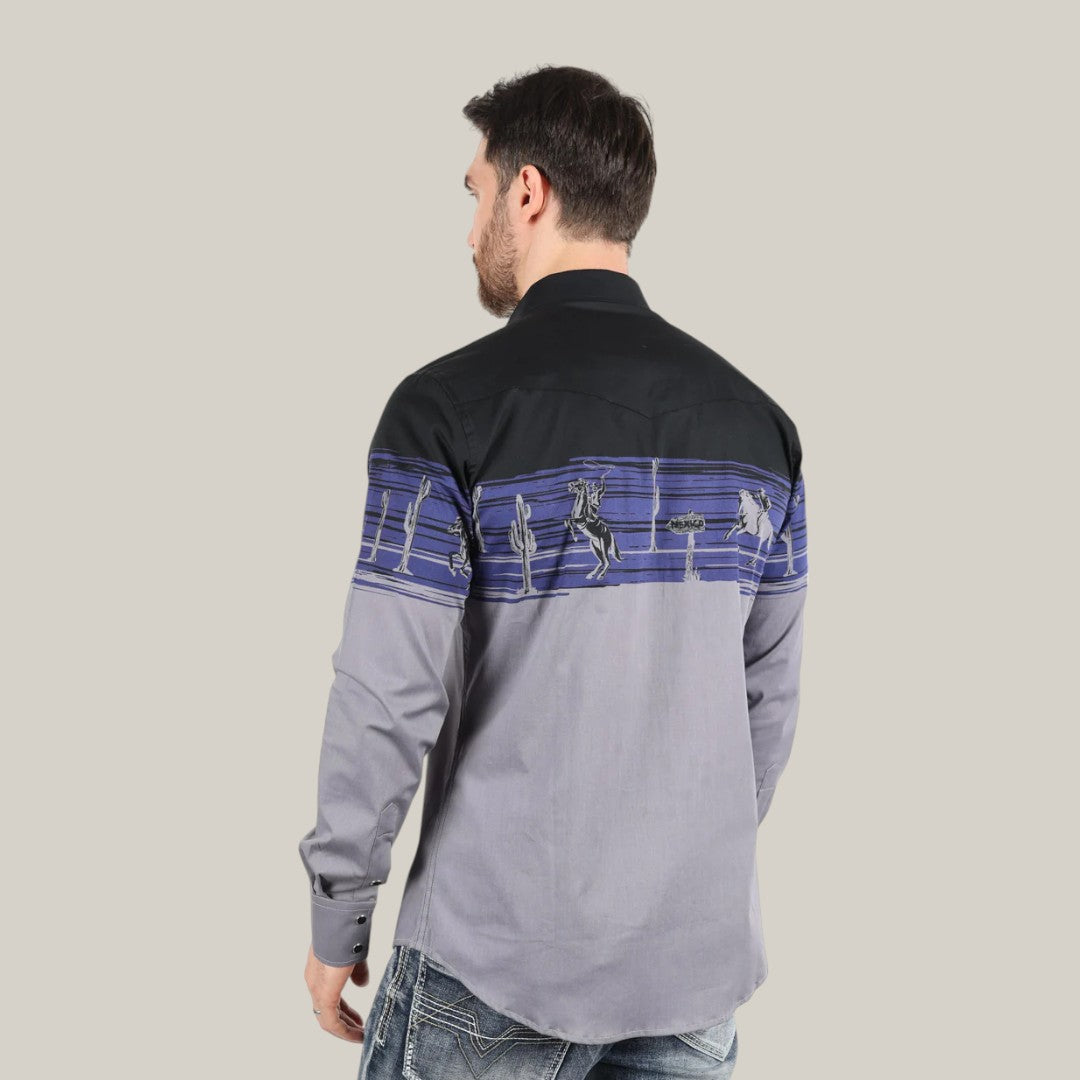 A man, with his back to the camera and short dark hair, wears the Modern Fit Cotton Stretch Rodeo Panoramic Print Shirt - AZL9941 by Platini. This shirt features a black, blue, and gray color block design with panoramic prints, paired stylishly with blue jeans against a light gray backdrop.