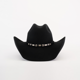 The 6X Chihuahua Black cowboy hat features a decorative band with silver conchos and designs, all on a plain white background.