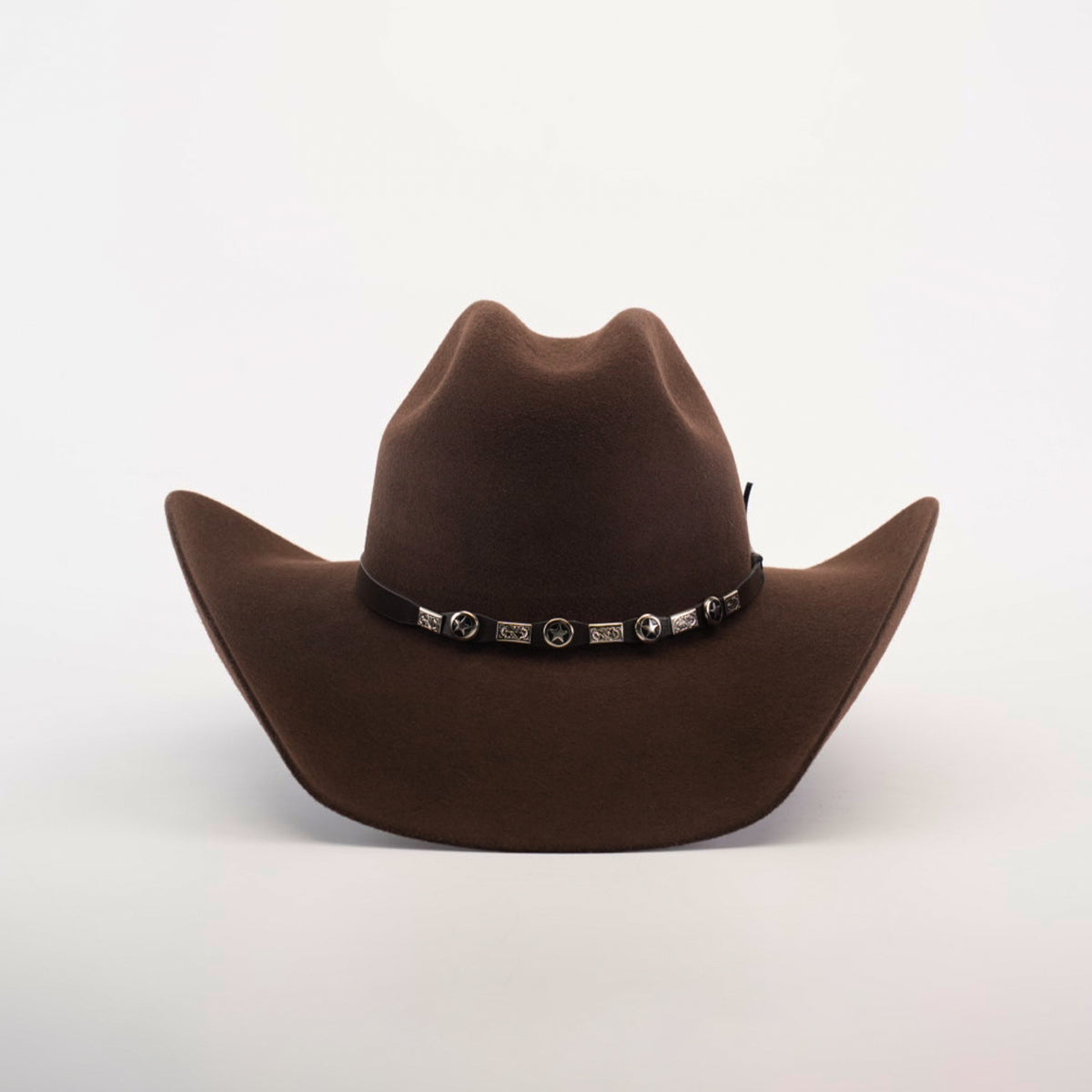 The 6X Chihuahua Brown is a Western hat, expertly crafted from premium sheep wool. It features a wide brim and decorative band with metal conchos, set against a plain white background.