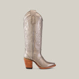 The Linda Tall Shaft Mercury - J Toe, a silver cowboy boot from the Platinum Collection, showcases intricate shaft patterns, a pointed toe, and a brown wooden block heel, stylishly displayed against a plain light background.