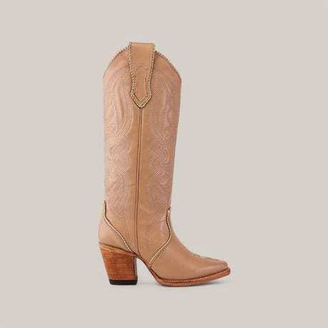 Part of the Platinum Collection, the Linda Studs Tall Shaft Cream - J Toe single boot showcases intricate stitching above the ankle and a wooden block heel, embodying high-end design elegance.