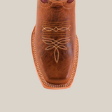 Close-up of the Grecas Orix - Short Shaft- Narrow Square Toe cowboy boot, showcasing intricate embroidery on the upper, visible detailed stitching, and textured brown leather exterior against a neutral white background.