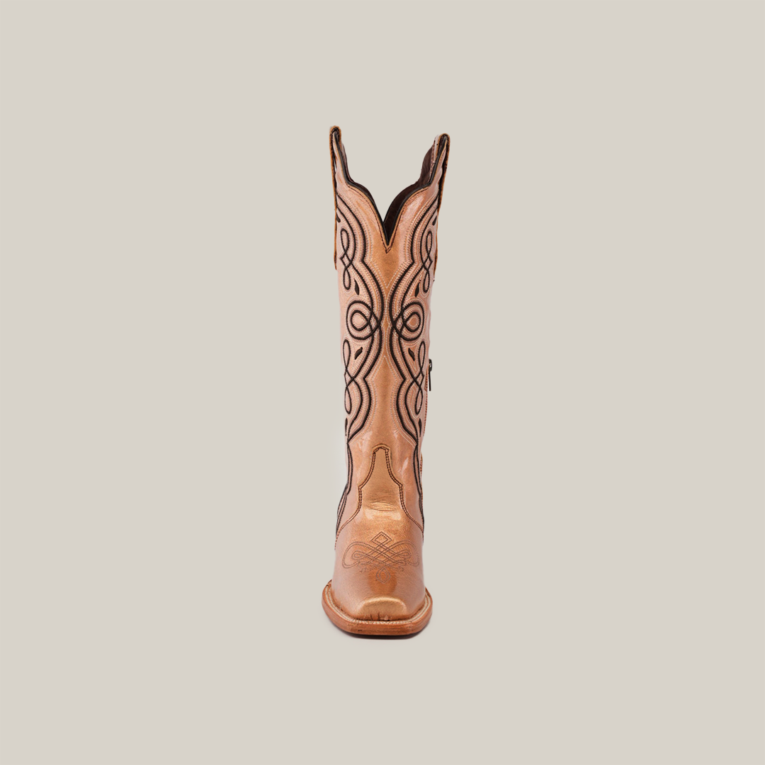 A single cowboy boot from the Eden Rose Gold collection stands upright against a plain background, featuring intricate dark stitching on its light tan leather with a smooth finish. The tall shaft and narrow square toe add elegance to this striking piece.