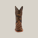 The Big Bass Pirarucu Print Rustic Orix - Square Toe is a brown cowboy boot made from durable cowhide leather with a rugged texture and intricate stitching. It stands upright against a plain white background, featuring a square toe and slightly worn appearance for authentic charm.