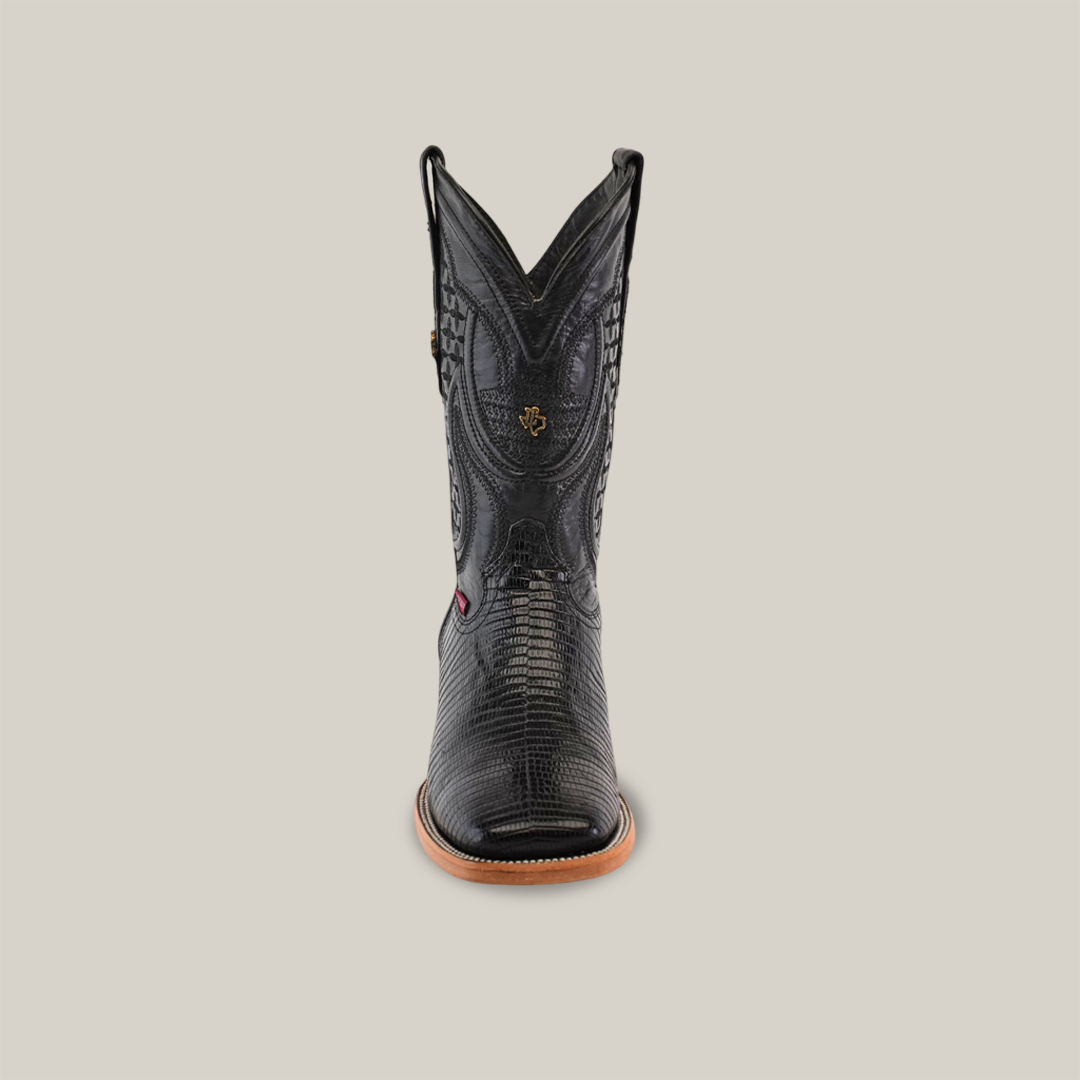 An upright black cowboy boot with a reptile-like texture and stylish square toe design is showcased against a white background. This Exotic Lizard - Black - Square Toe boot features intricate shaft stitching and a tan sole.