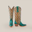 The Premier Turquoise Handtooled Flowers boots combine turquoise and tan leather with a wavy pattern and hand-tooled floral details, featuring a wooden heel and pointed snip toes against a plain white background.