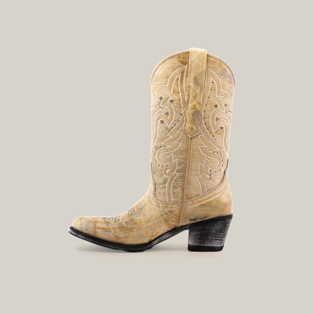 Displayed against a white background is the Cowhide Hortus Rustic White, a tan mid-shaft cowboy boot with intricate stitching and crafted from cowhide leather. It features a round toe and a black, slightly angled heel, exemplifying superior craftsmanship.