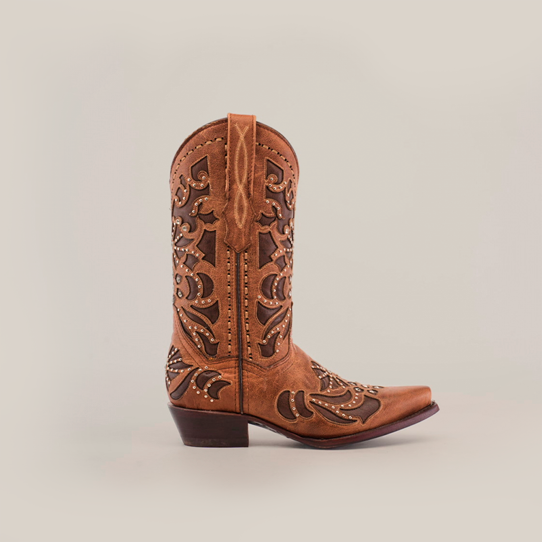 A single Cotulla Tabaco Crystals cowboy boot is showcased against a white backdrop, emitting Western sophistication. Its detailed leather patterns on the shaft and vamp highlight its elegance, while a snip toe and low heel complete this handcrafted masterpiece.