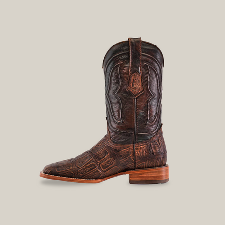 A single Gator Print Rustic Brown boot features a dark leather with a textured gator print, square toe, low heel, and decorative stitching on the shaft. It is displayed on a plain white background.