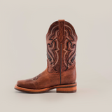 The Fresno Shedron Slip Resistant Sole Rodeo Toe boot is a single brown cowboy boot on a white background, with intricate stitching, a leather pull tab, rodeo toe, wooden heel, and slip-resistant sole for style and function.