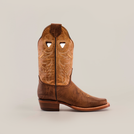 The Western Stitch Camel - Short Shaft - Narrow Square Toe is a premium leather cowboy boot with intricate embroidery on the shaft and a solid wooden heel, all presented against a plain white background.