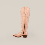 A single tall beige cowboy boot with decorative stitching and a side zipper is showcased against a white backdrop, echoing the iconic Sara Metalic Florentine - Tall Shaft - Snip Toe design.