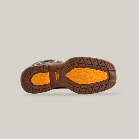 The image displays the sole of the Navy Brown US Flag soft toe waterproof work boot. It features a rugged tread pattern with brown outer edges and a yellow-textured center. Crafted from premium cowhide leather, there is embossed text near the heel.