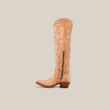 The Tania Orix is a tall, brown womens boot with a snip toe, intricate stitching, side zipper, and low heel, shown on a white background.