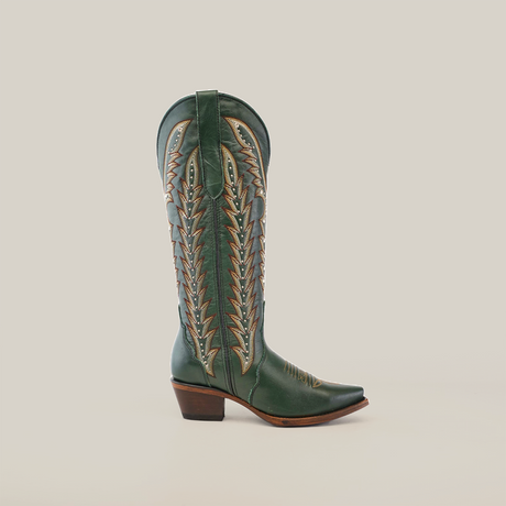 Introducing the Madona Forest Green boots: handcrafted, knee-high with a tall shaft and snip toe. Made from premium leather, they feature intricate stitching patterns and a wooden heel, all elegantly showcased against a plain white background.