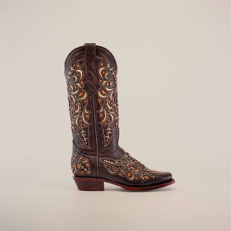 A single dark brown cowboy boot crafted from premium leather, with intricate tan floral and leaf embroidery, reminiscent of the Kiara Crystals Chocolate Mid Shaft - Narrow Square Toe Boot, displayed against a plain white background.