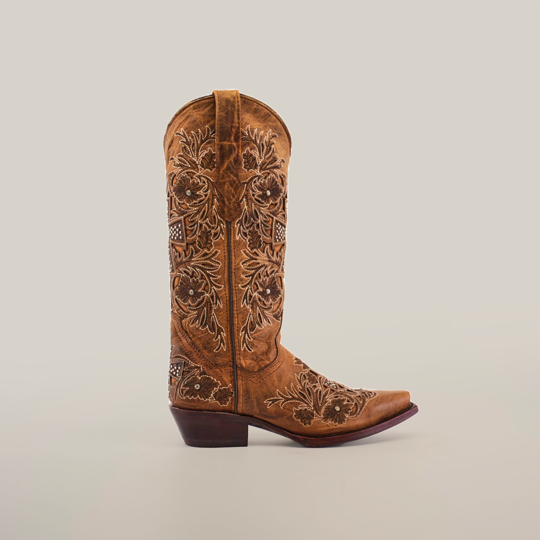 The Alamo Camel Crystals boot boasts intricate floral embroidery on the shaft, exemplifying artisanal craftsmanship. Designed for women, it features a snip toe and low heel, all set against a plain white background.