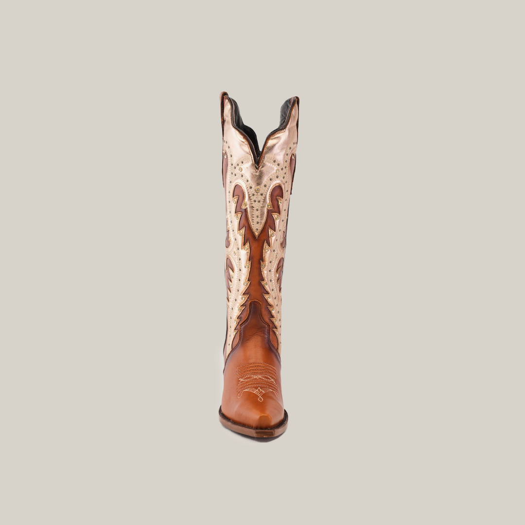 A Valentina Cogñac Tall Shaft Snip Toe boot displays intricate patterns while standing upright on a white background. Its premium brown leather features lighter accents and detailed stitching, exuding classic Western flair in its traditional design.