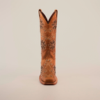 Front view of a single tall brown cowboy boot, Napoles Crystals Flowers Fawn - Mid Shaft - Narrow Square Toe, showcasing handcrafted floral embroidery, set against a plain white background.