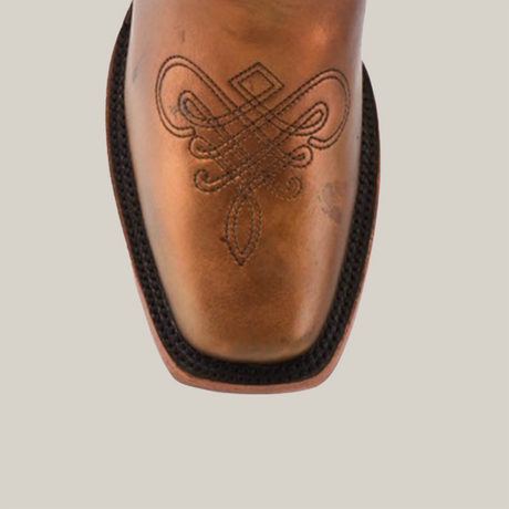 Close-up of the Eden Copper - Tall Shaft - Narrow Square Toe boot in premium leather, featuring luxury craftsmanship. The brown boot displays intricate square toe stitching in a symmetrical pattern, elegantly highlighted against a plain white background.