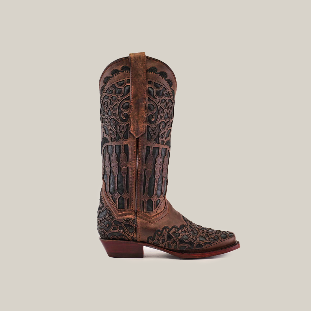 A single Taurine Chocolate cowboy boot, handcrafted luxury with intricate black patterns, made from premium leather. This mid-shaft boot features a narrow square toe and low heel, set against a plain white background.