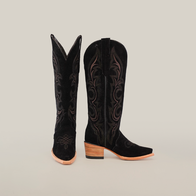 Amara Black Suede cowboy boots feature a snip toe, intricate brown embroidery, and a wooden heel against a plain white background.