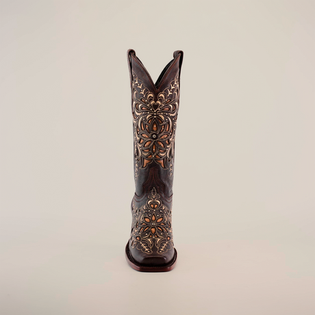 A single ornate cowboy boot showcases intricate gold and silver floral patterns on premium leather, set on a plain white backdrop. The exquisite Kiara Crystals Chocolate - Mid Shaft - Narrow Square Toe boot embodies elegance and timeless style.