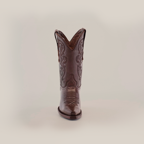 The Plane Jane Moka boot features intricate stitching and embroidery, showcased from the front against a white backdrop. This handcrafted short-shaft, snip-toe design captures the essence of Western aesthetics.