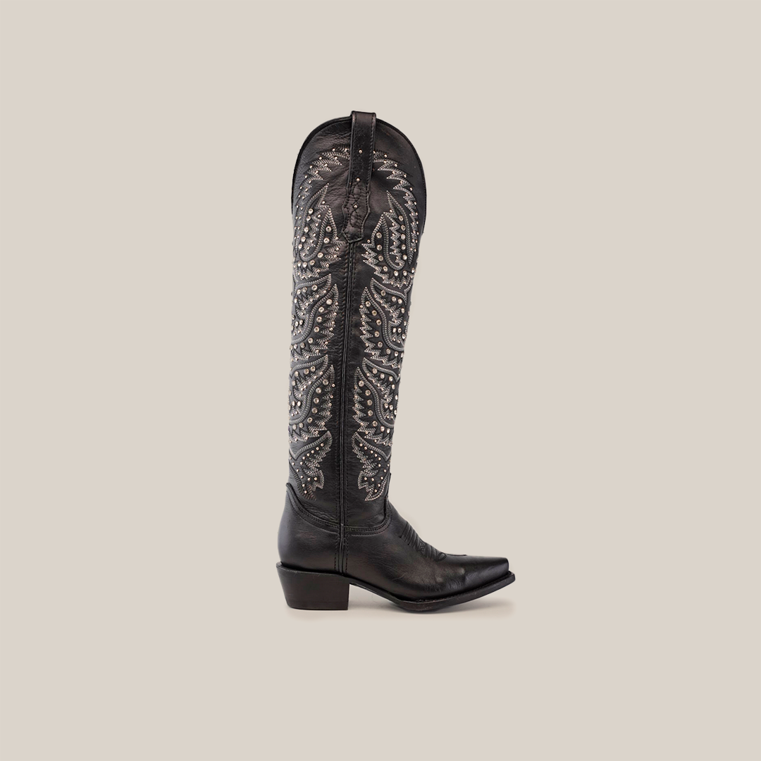 Presenting the Crystals Wings Black Lustre - Tall Shaft - Snip Toe boot: a single black cowboy boot with intricate embroidery and studded shaft details. Handcrafted with a premium leather sole, it features a snip toe and low heel against a white backdrop.