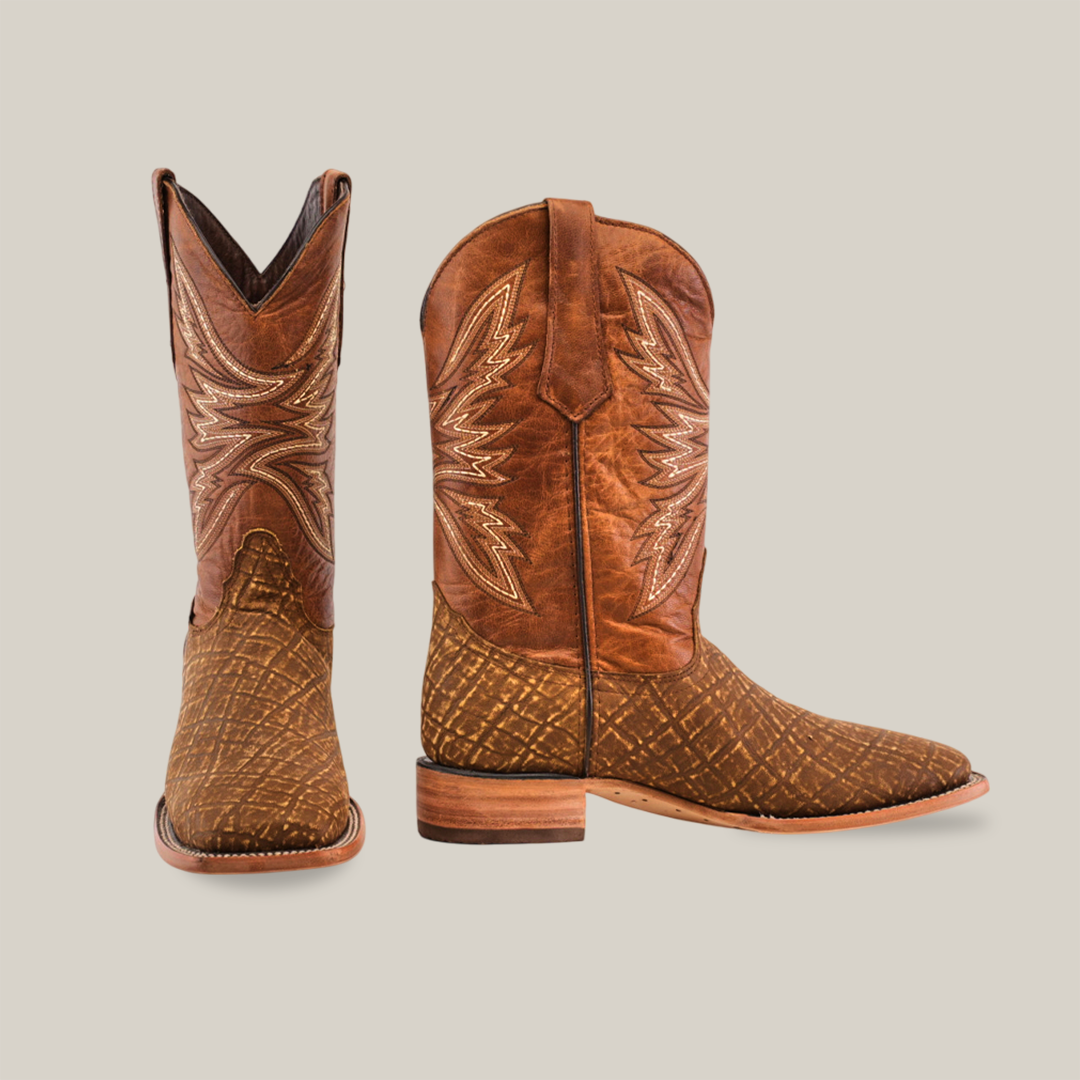 The Elephant Print Orix - Square Toe boots, made from premium leather with intricate stitching and a textured pattern, are shown in two angles. One boot faces forward and the other is angled to reveal their exquisite design against a plain white background.