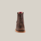 Front view of the Alamo Brown Square Toe boot with a wooden sole and red fabric pull tab, centered on a white background, showcasing its handcrafted Western fashion charm.