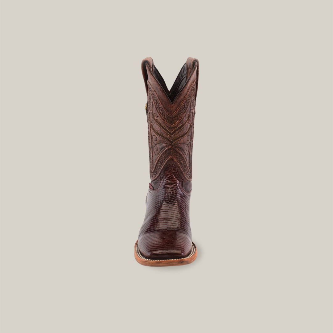 Front view of a brown Exotic Lizard cowboy boot, featuring detailed stitching on the shaft and crafted from genuine lizard leather, set against a plain background.